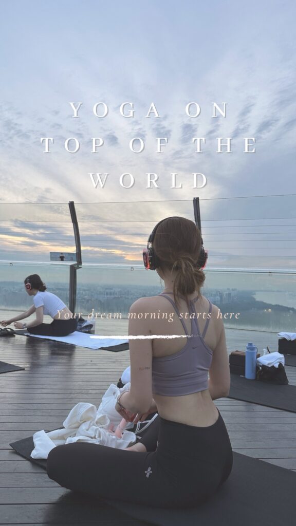 Woman doing yoga at Marina Bay Sands SkyPark during sunrise