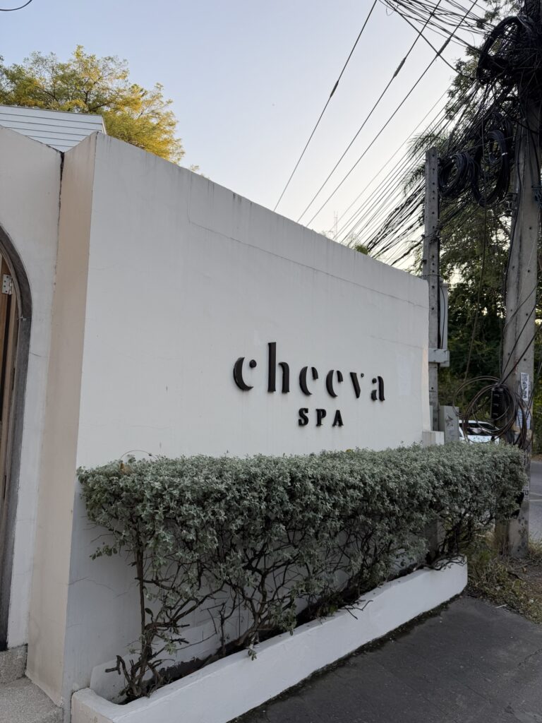 Entrance of Cheeva Spa in Chiang Mai with lush tropical greenery