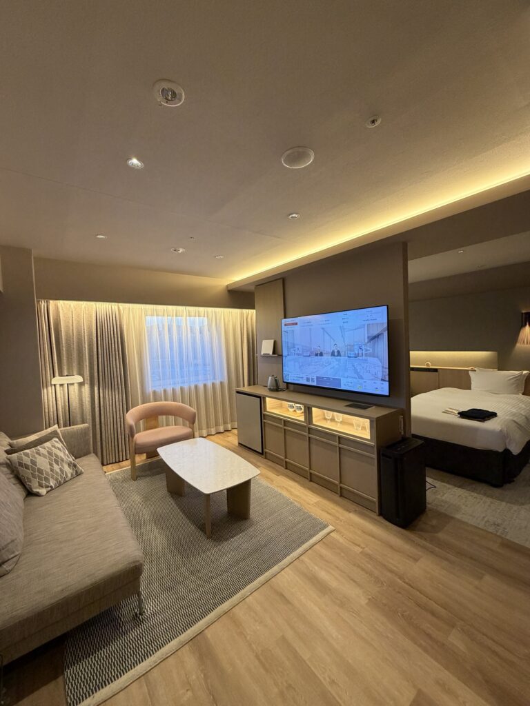 Richmond Hotel Obihiro Ekimae junior suite living area with sofa and TV